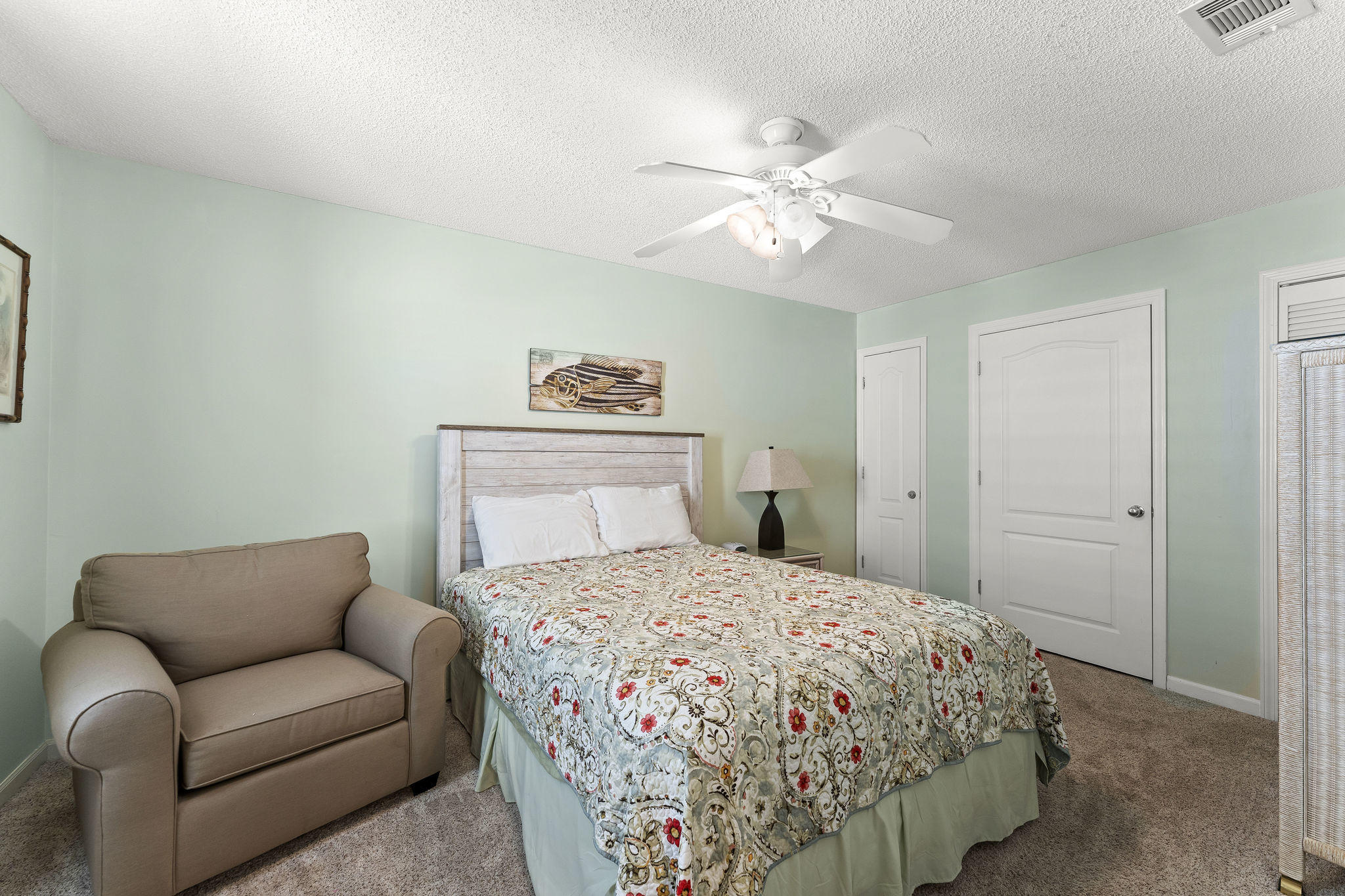 17462 Front Beach Road, Unit 77H Panama City Beach, FL 32413 - Photo 13 of 28 a bedroom with a bed and a chandelier