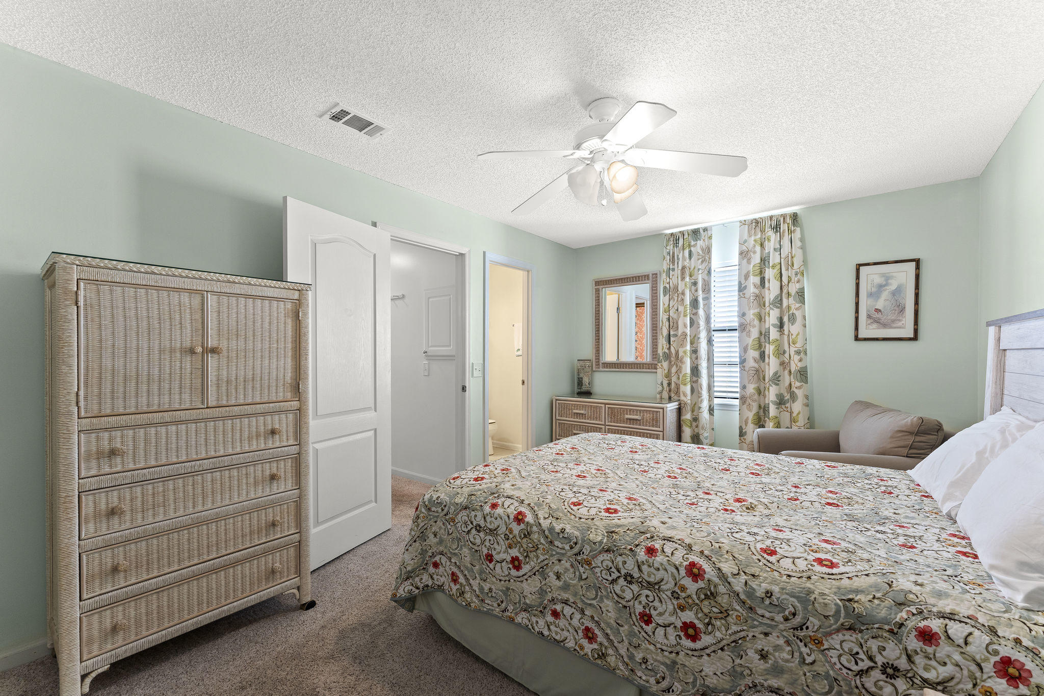 17462 Front Beach Road, Unit 77H Panama City Beach, FL 32413 - Photo 14 of 28 a bedroom with a bed and a dresser
