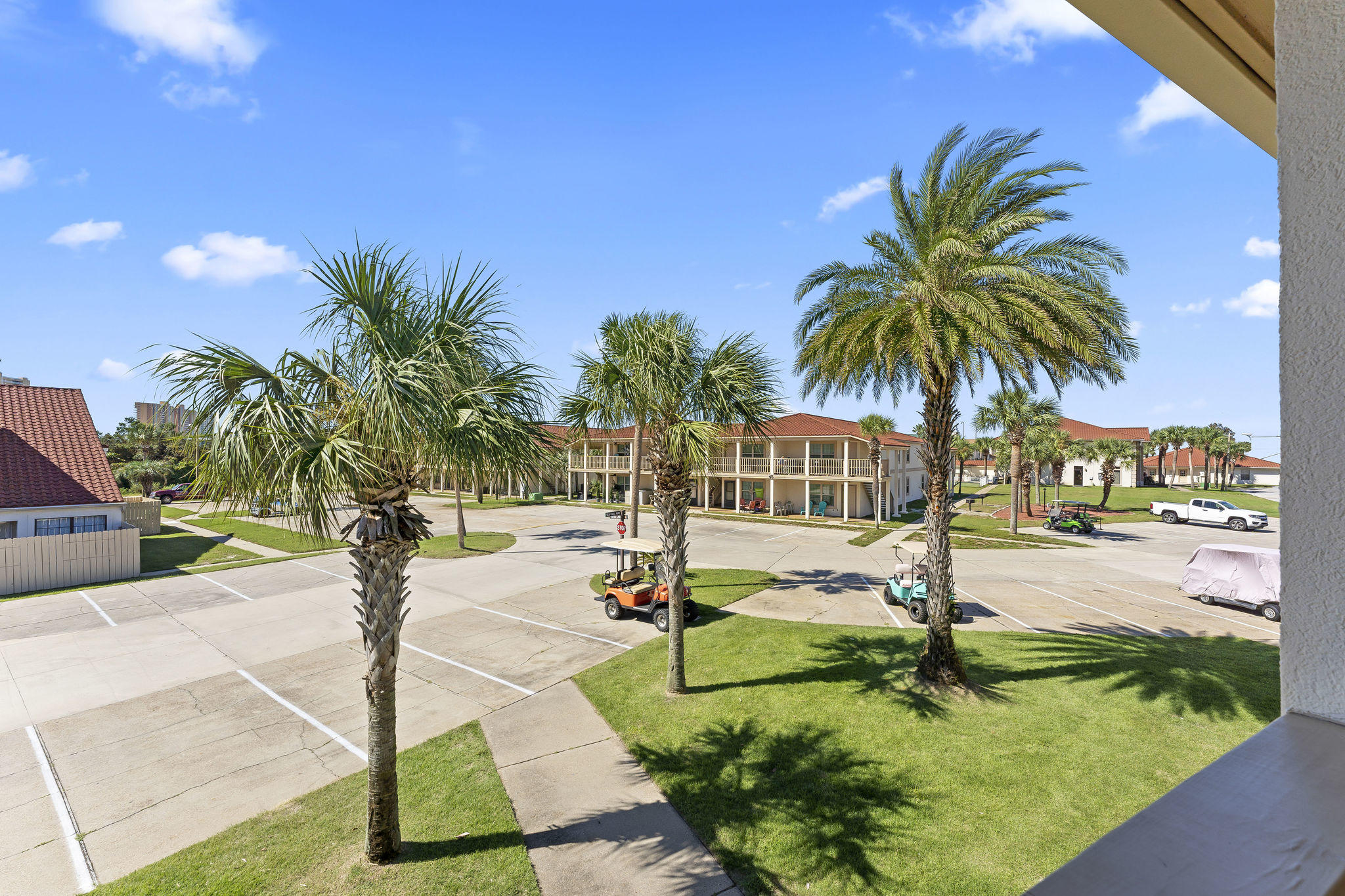17462 Front Beach Road, Unit 77H Panama City Beach, FL 32413 - Photo 17 of 28 a swimming pool with outdoor seating and yard