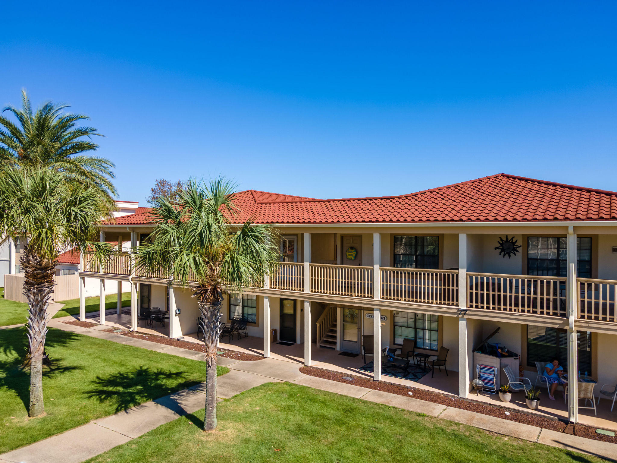 17462 Front Beach Road, Unit 77H Panama City Beach, FL 32413 - Photo 2 of 28 a front view of a house with a garden