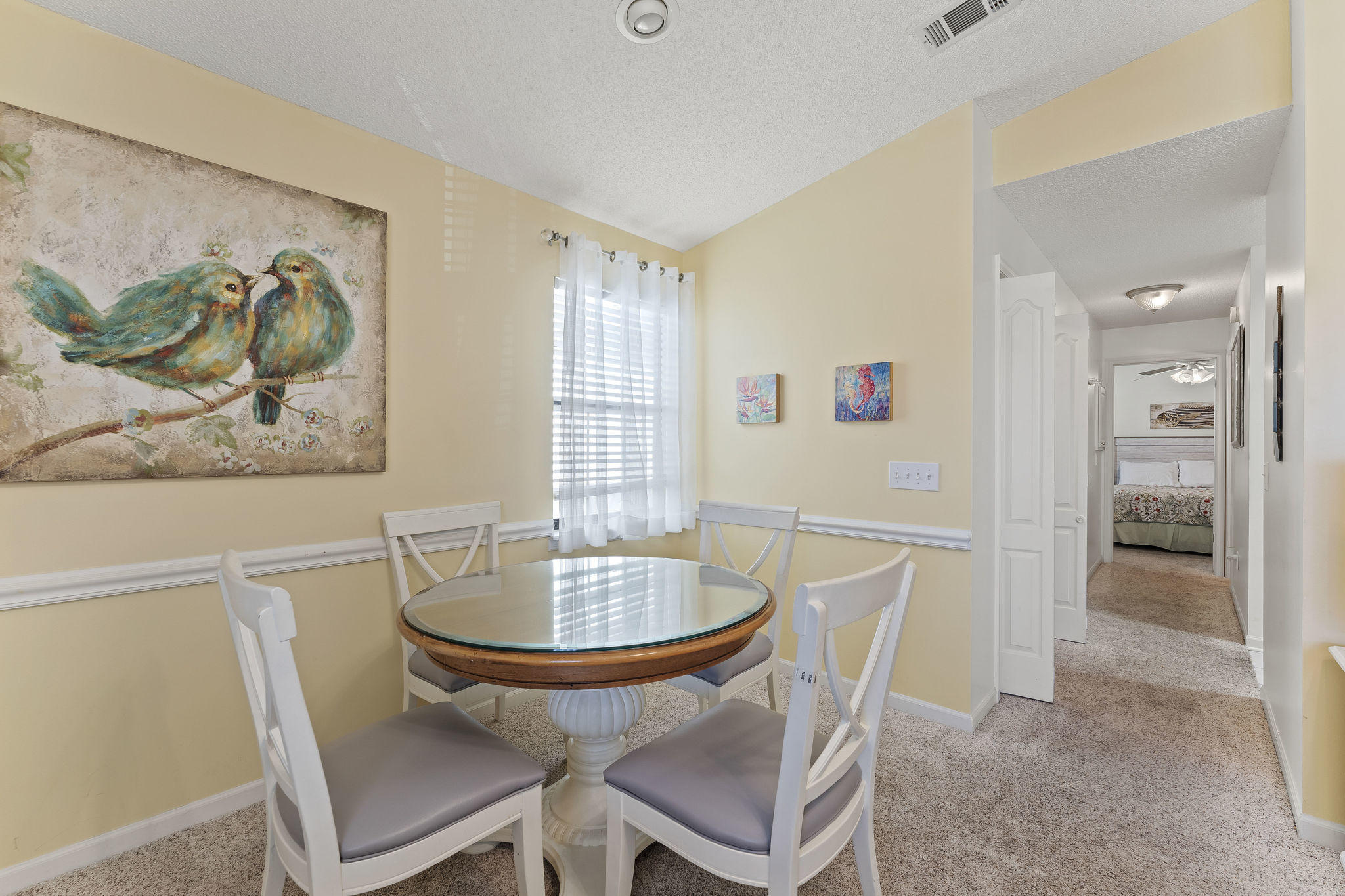 17462 Front Beach Road, Unit 77H Panama City Beach, FL 32413 - Photo 4 of 28 a dining room with furniture and window