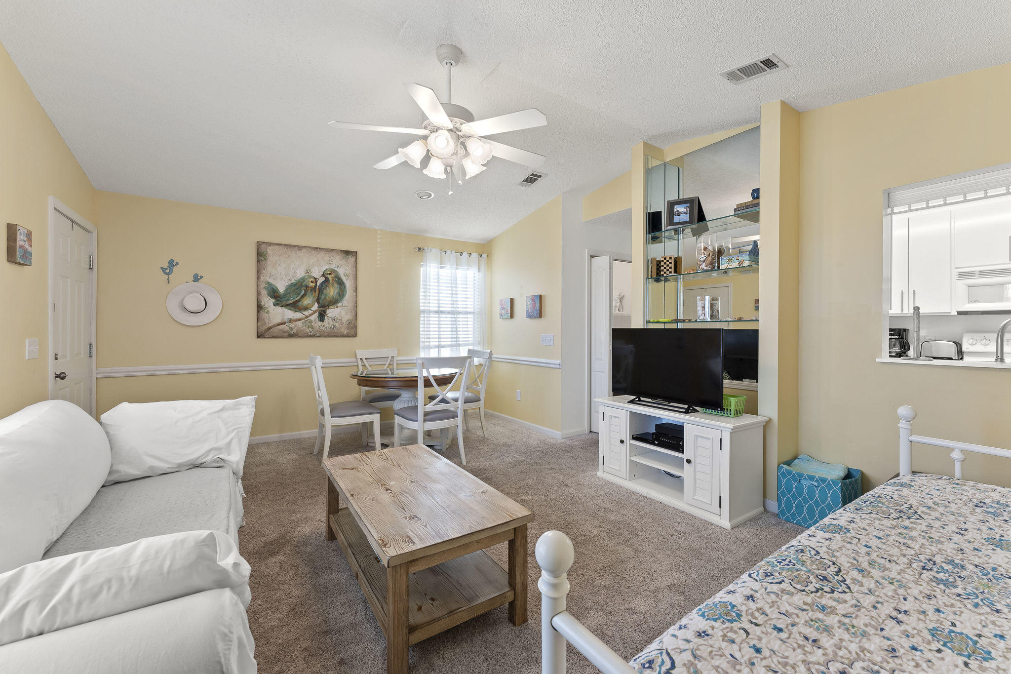 17462 Front Beach Road, Unit 77H Panama City Beach, FL 32413 - Photo 5 of 28 a living room with furniture and a flat screen tv