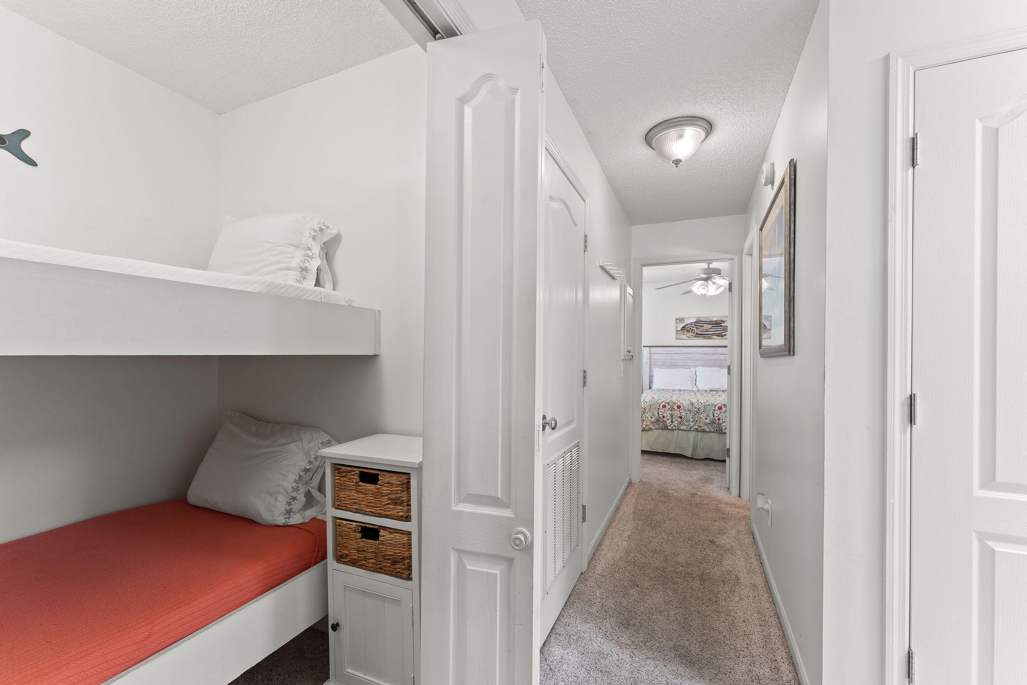 17462 Front Beach Road, Unit 77H Panama City Beach, FL 32413 - Photo 8 of 28 a bedroom with a bed and a view of bathroom