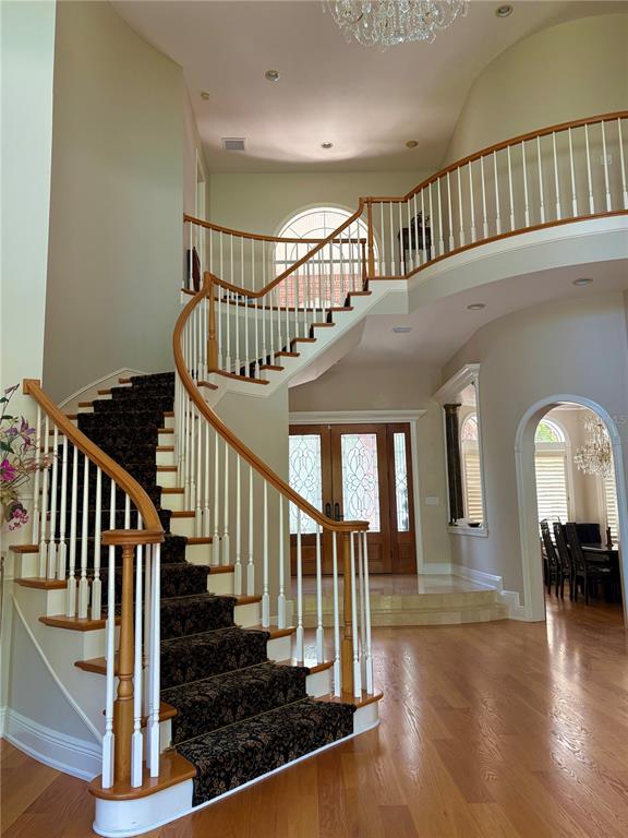 2817 Roehampton Close Tarpon Springs, FL 34688 - Photo 3 of 4 a view of staircase with lots of frames and frames on wall windows