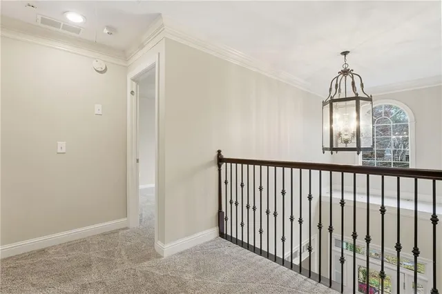 a bedroom with a bed couch and window