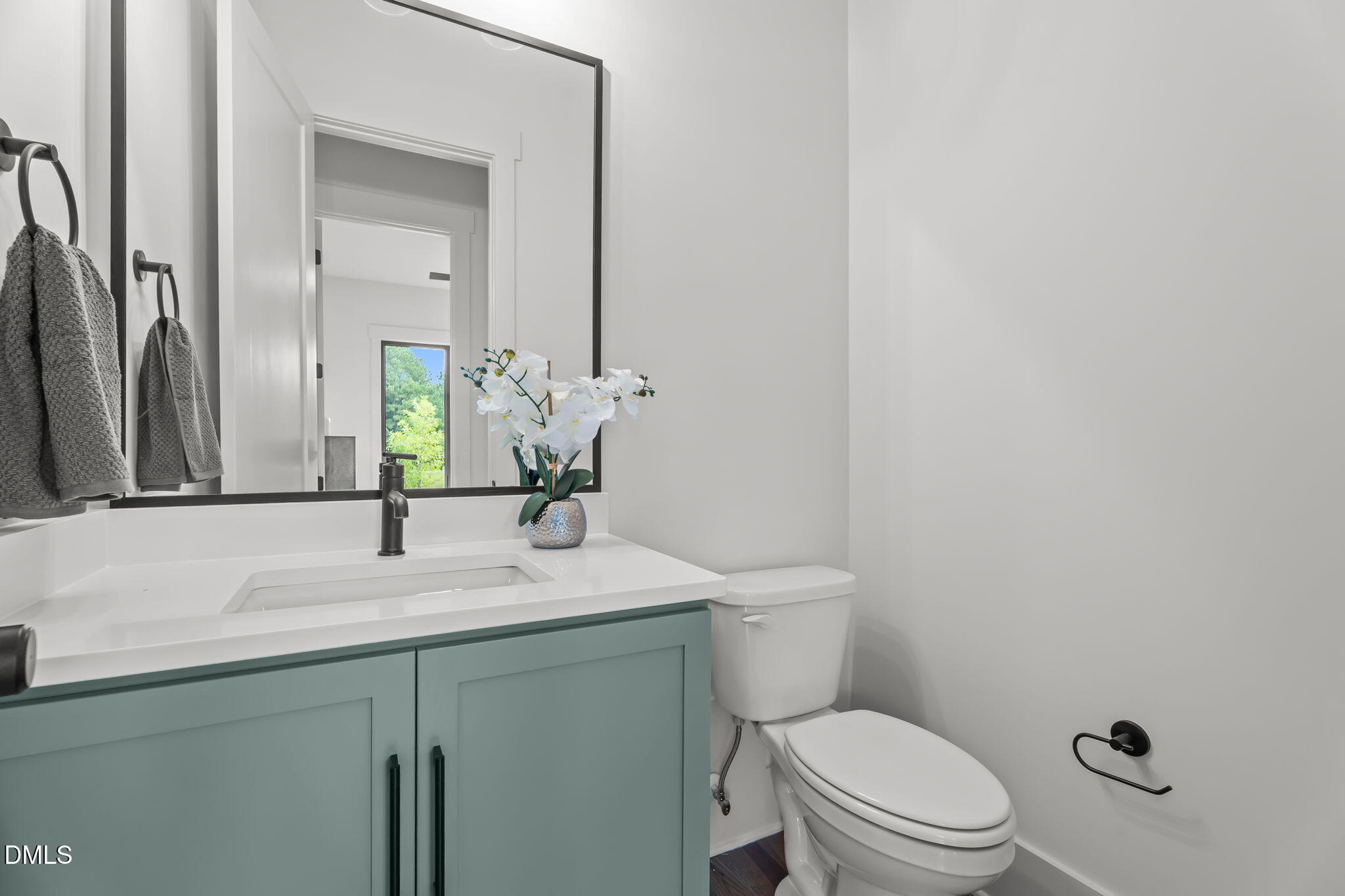 200 Broadleaf Lane Louisburg, NC 27549 - Photo 23 of 57 a bathroom with a granite countertop toilet sink and mirror