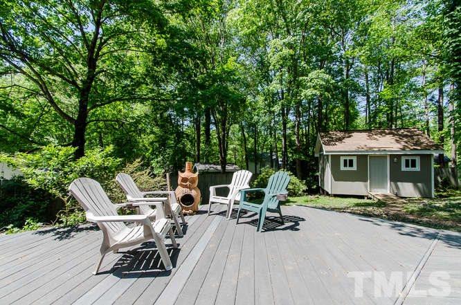 1020 Mockingbird Drive Raleigh, NC 27615 - Photo 22 of 25 a view of a patio with table and chairs and wooden floor