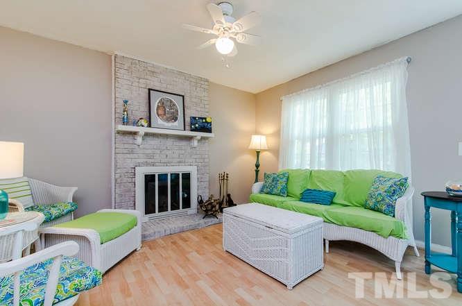 1020 Mockingbird Drive Raleigh, NC 27615 - Photo 5 of 25 a living room with furniture and a fireplace
