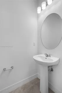 a bathroom with a sink a mirror and shower