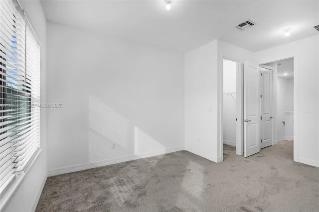 a view of a room with racks on the wall