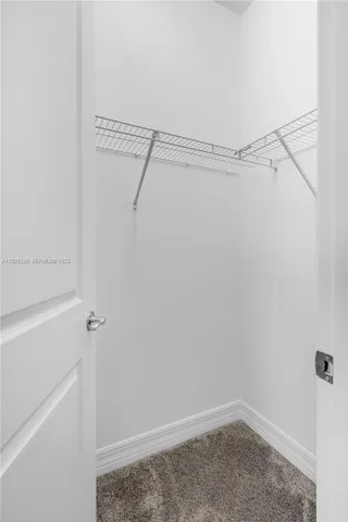 a bathroom with a double vanity sink toilet and shower