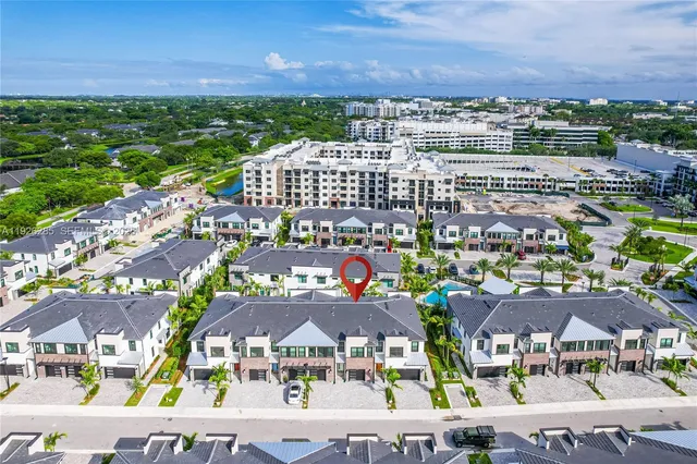 a view of swimming pool with outdoor seating and city view