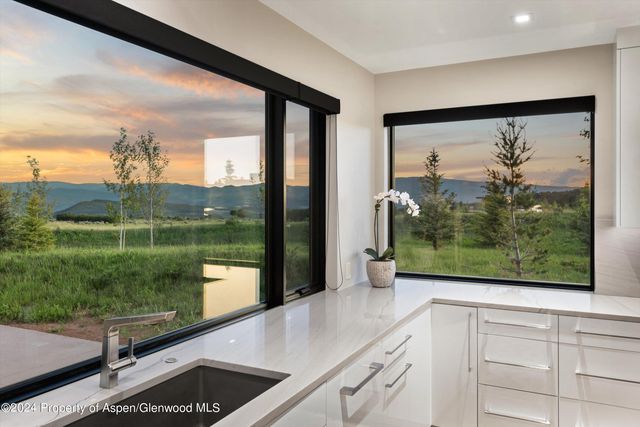 a view of a window and a lake view