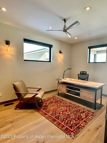 a bedroom with a bed and a television