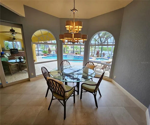 a view of a dining room with furniture window and outside view