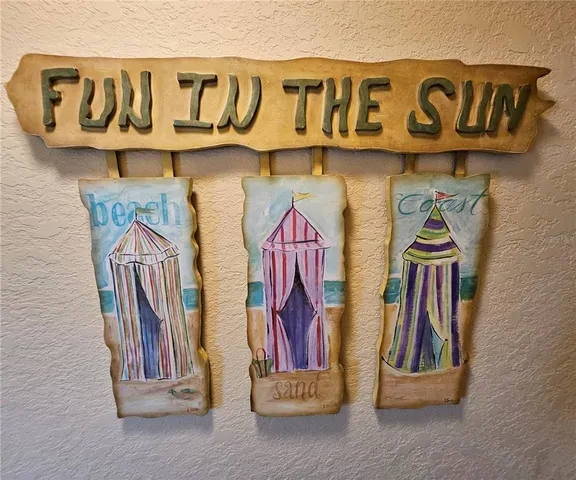 a view of a chairs and table in backyard under an umbrella