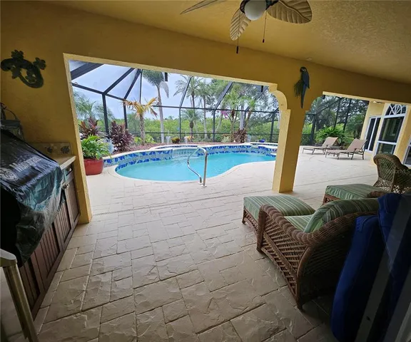 a view of a swimming pool with a patio