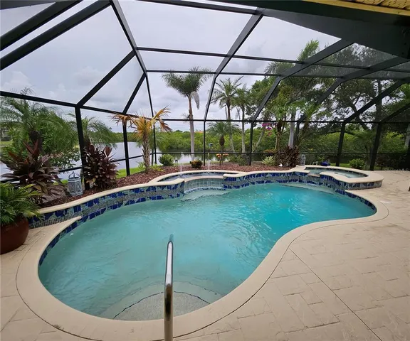 a view of a swimming pool with a patio