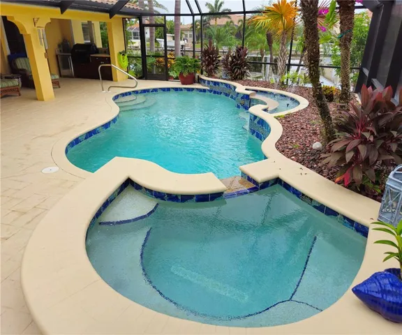 a view of a swimming pool with a patio