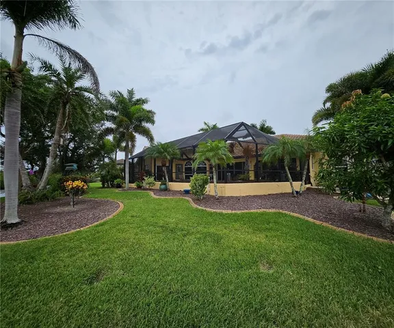 a view of a lake with houses in the back