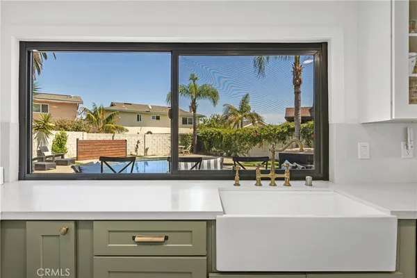 a view of living room with furniture and window