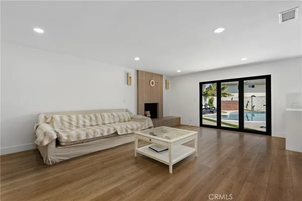a spacious bedroom with a bed and a couch