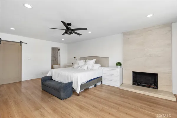 a bed room with a bed and a fireplace