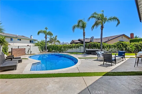 a view of a backyard with sitting area