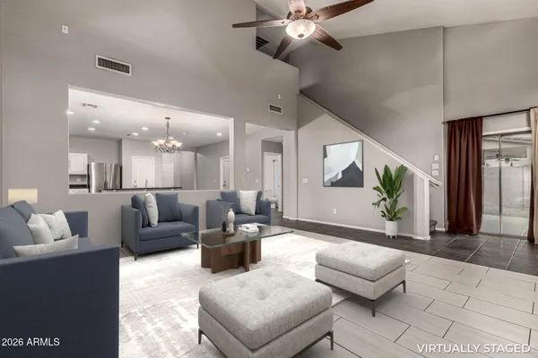 a living room with furniture and a large window