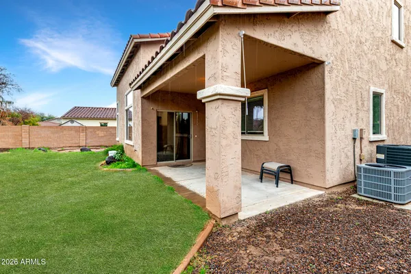 a view of a house with a yard and table