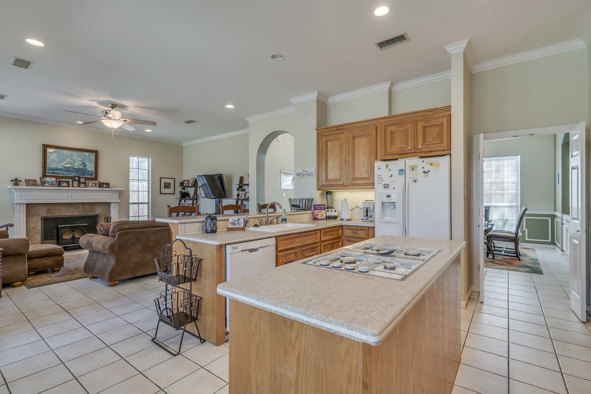 2500 Centerline Road Conroe, TX 77384 - Photo 12 of 28 a living room with furniture a fireplace and kitchen view