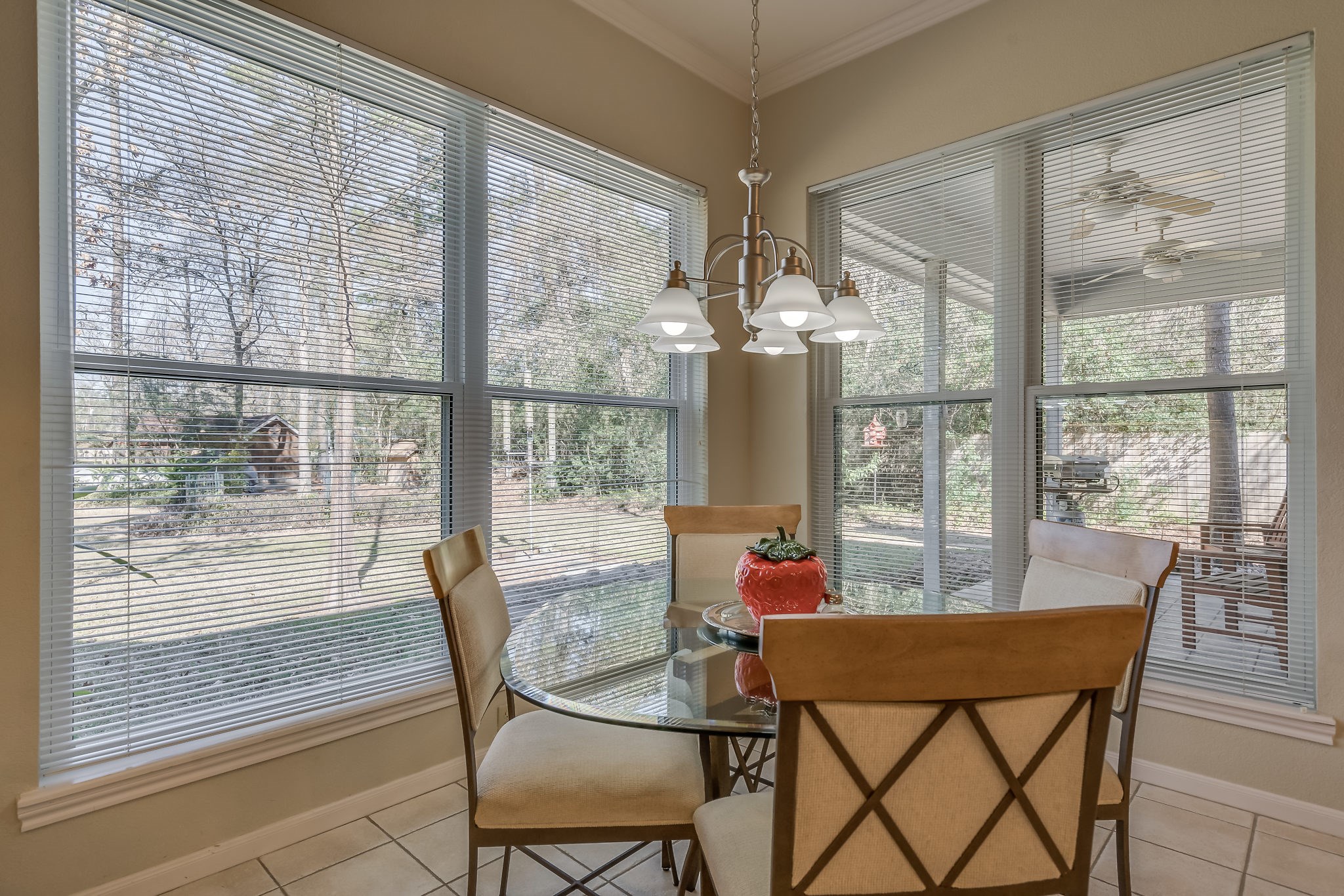 2500 Centerline Road Conroe, TX 77384 - Photo 15 of 28 a dining room with furniture large windows and a chandelier