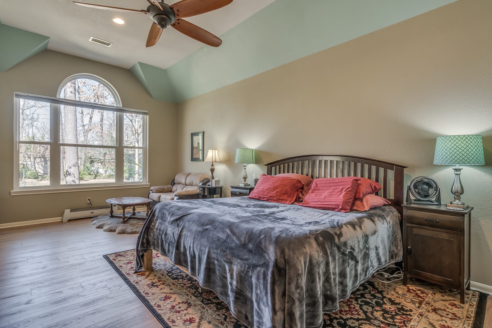 2500 Centerline Road Conroe, TX 77384 - Photo 16 of 28 a bedroom with a bed next to a window and a chandelier