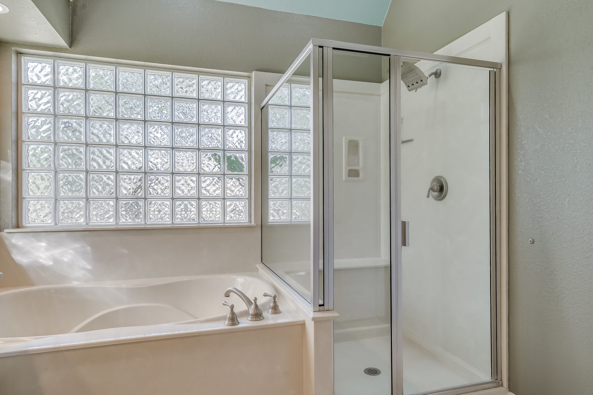 2500 Centerline Road Conroe, TX 77384 - Photo 19 of 28 a bathroom with a bathtub and a shower
