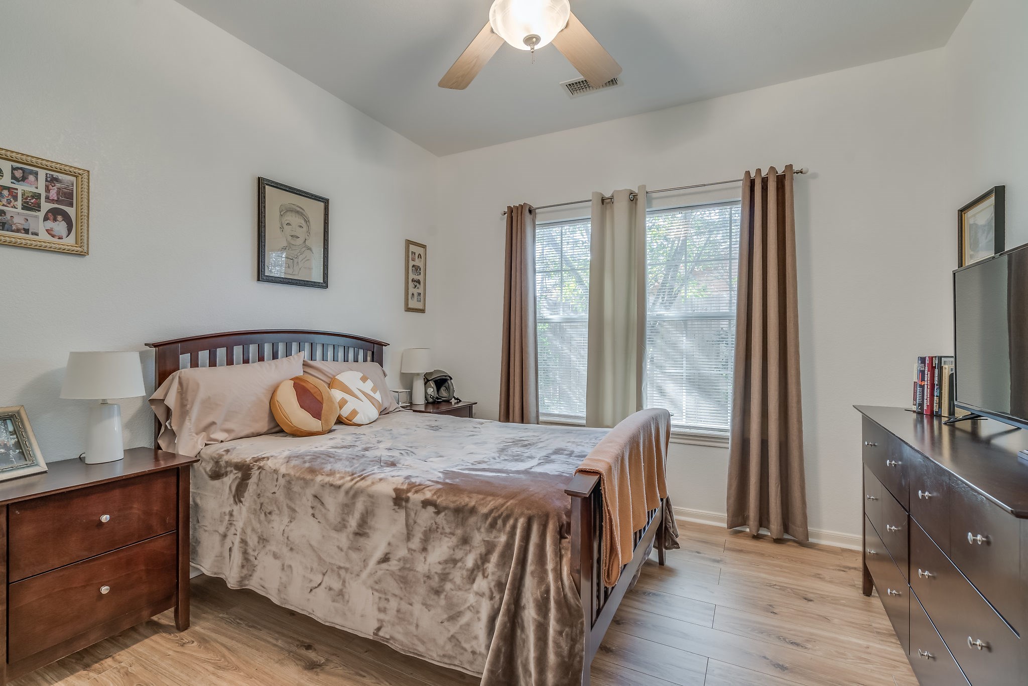 2500 Centerline Road Conroe, TX 77384 - Photo 20 of 28 a bedroom with a bed and a flat tv screen on dresser