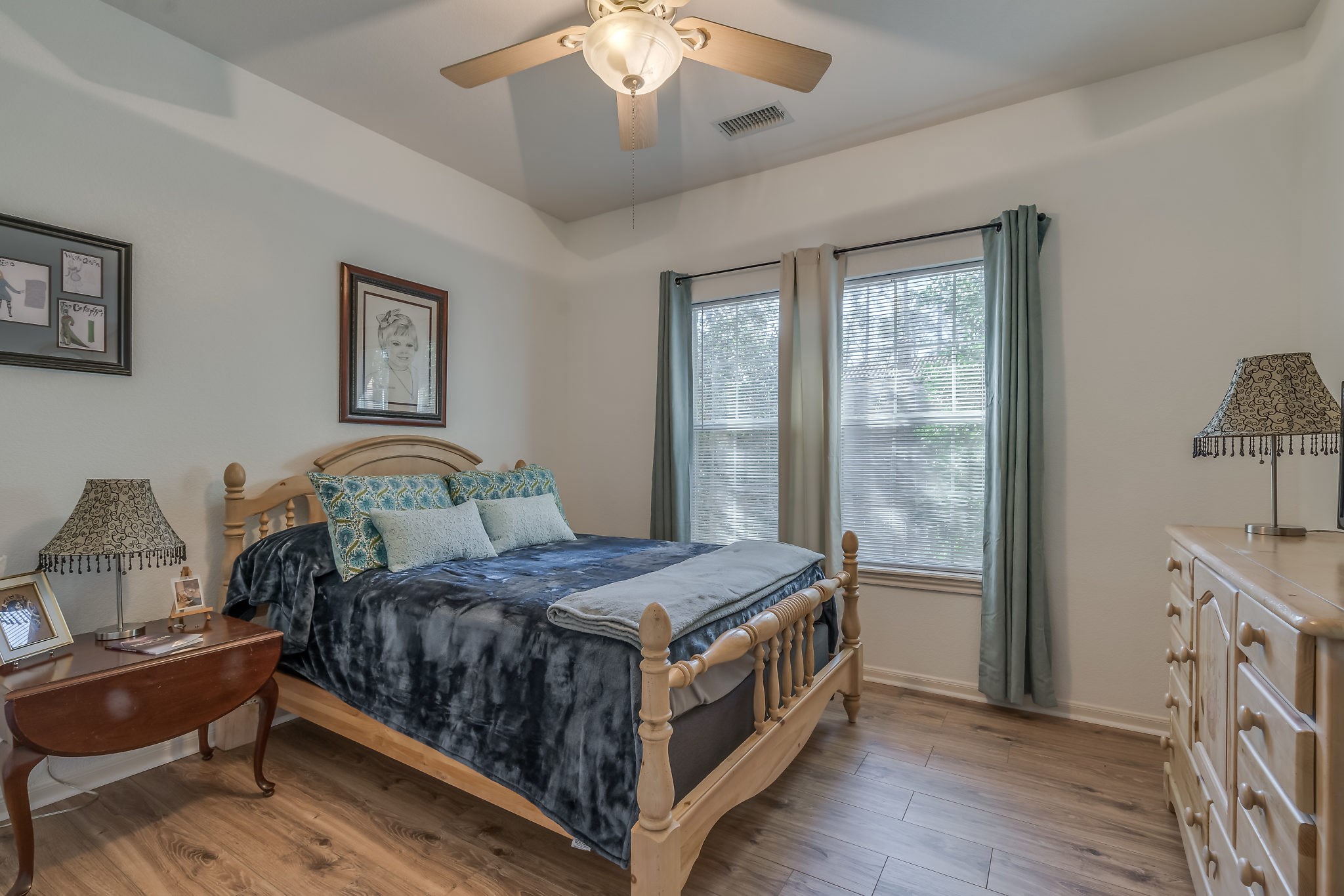 2500 Centerline Road Conroe, TX 77384 - Photo 21 of 28 a bedroom with a bed and a chandelier