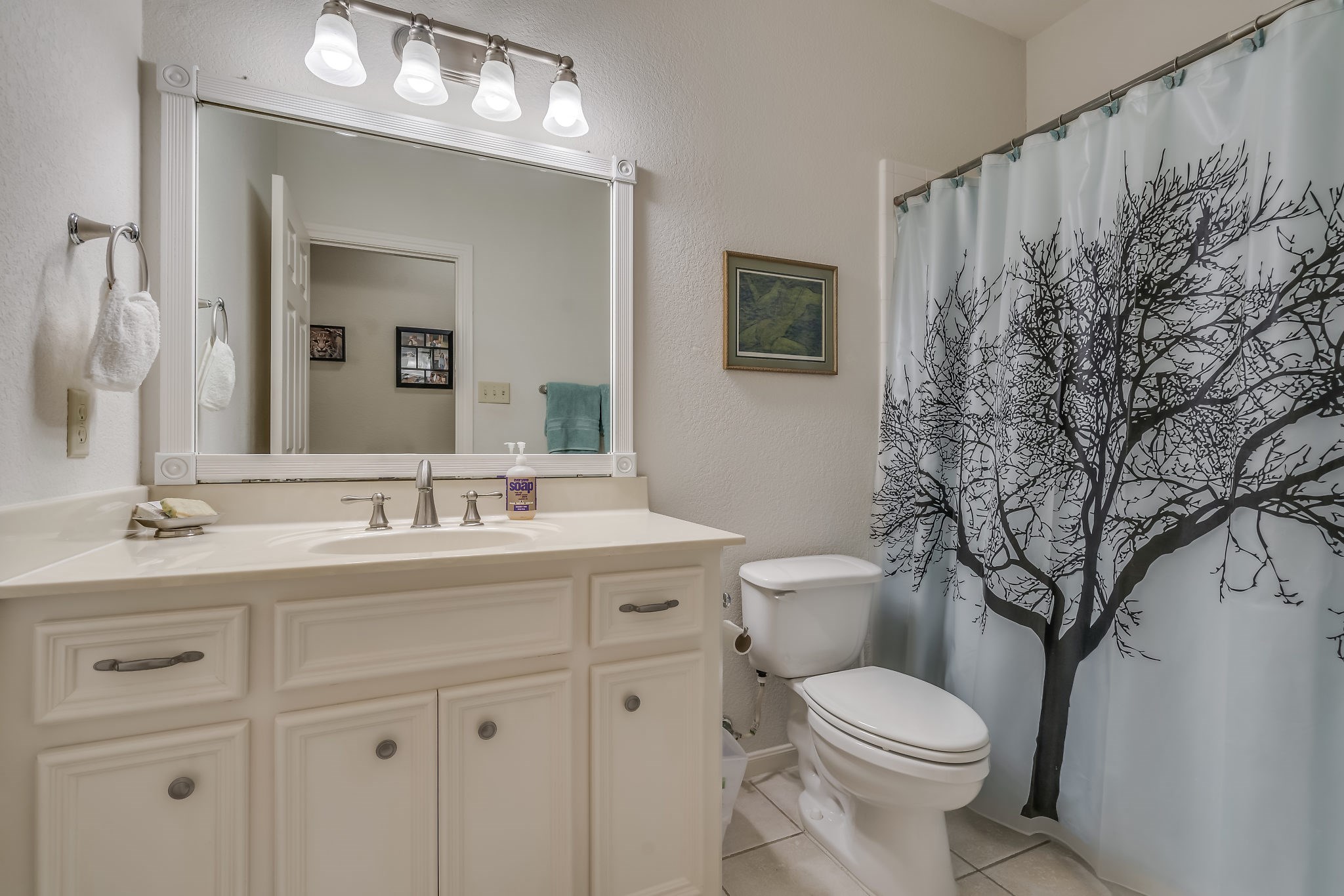 2500 Centerline Road Conroe, TX 77384 - Photo 22 of 28 a bathroom with a toilet a sink and mirror