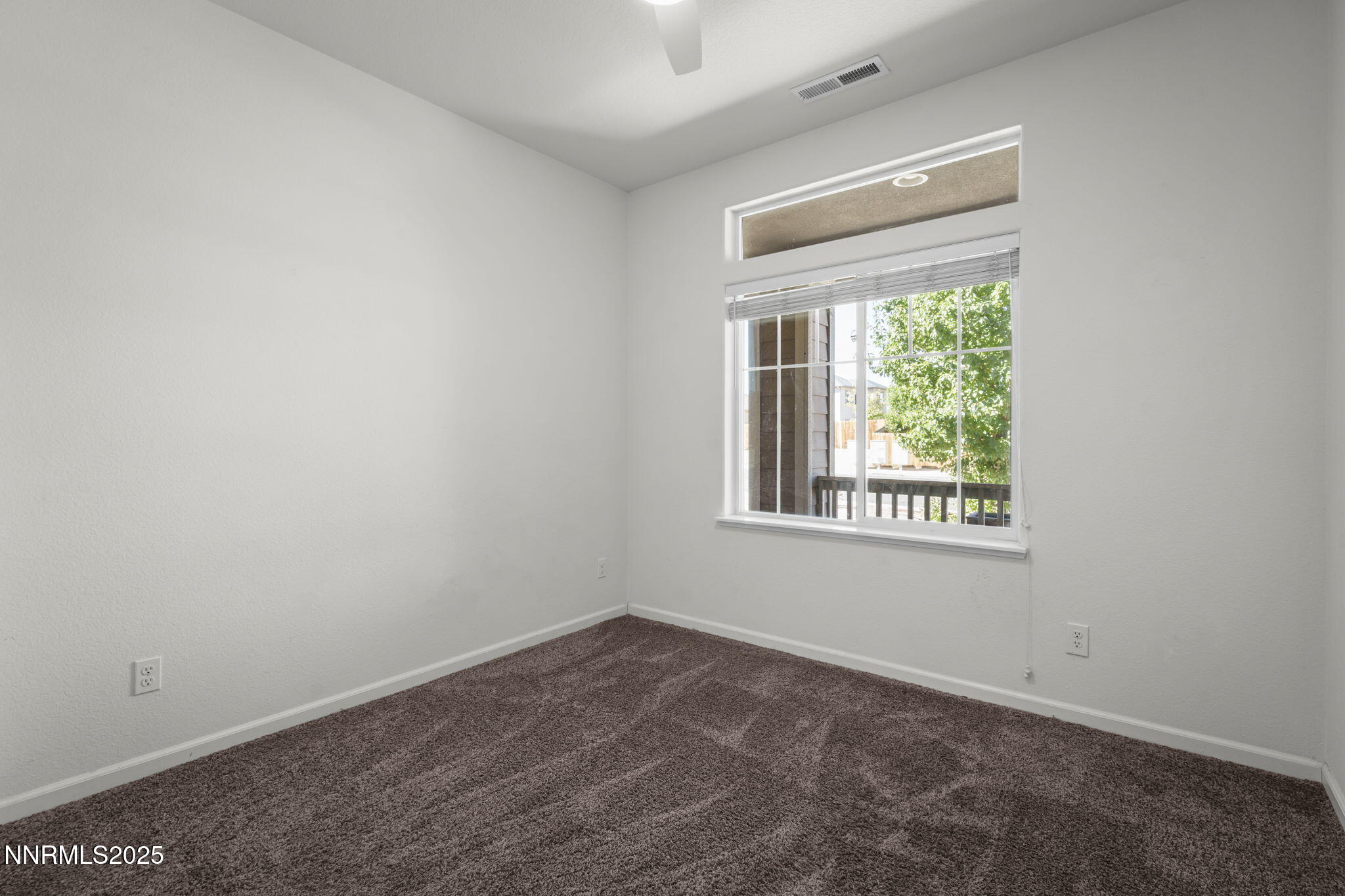 1187 Jasmine Lane Fernley, NV 89408 - Photo 12 of 22 an empty room with a window