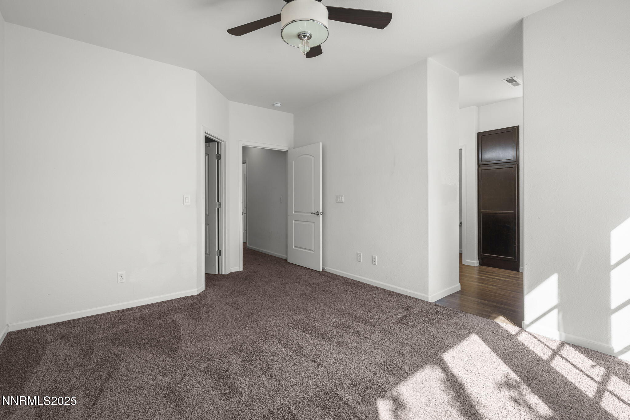 1187 Jasmine Lane Fernley, NV 89408 - Photo 14 of 22 a view of a livingroom with a ceiling fan and window