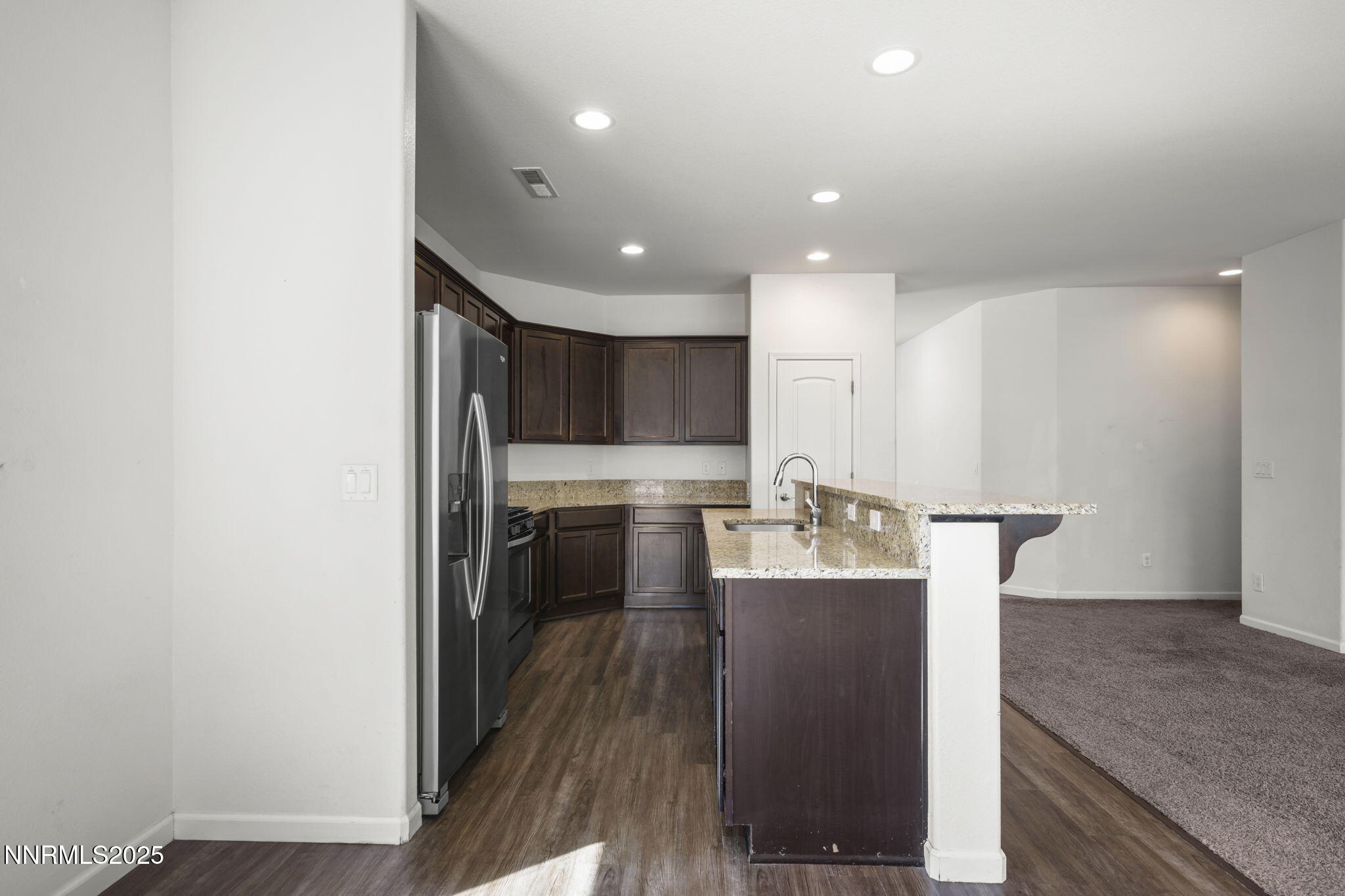 1187 Jasmine Lane Fernley, NV 89408 - Photo 4 of 22 a kitchen with counter top space and cabinets