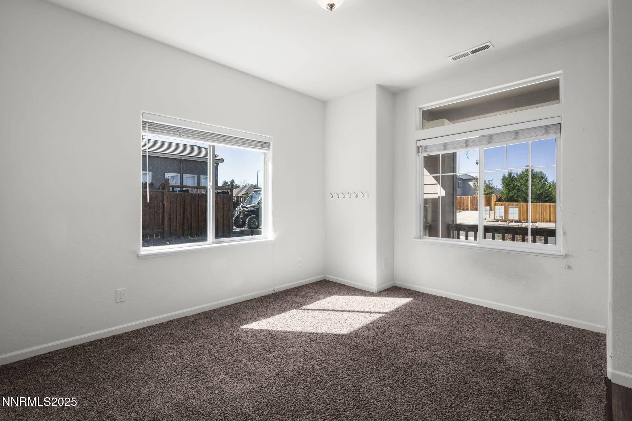 1187 Jasmine Lane Fernley, NV 89408 - Photo 7 of 22 an empty room with windows