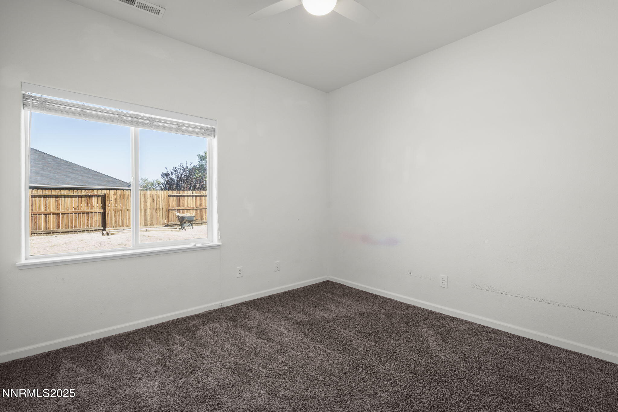 1187 Jasmine Lane Fernley, NV 89408 - Photo 9 of 22 an empty room with a window