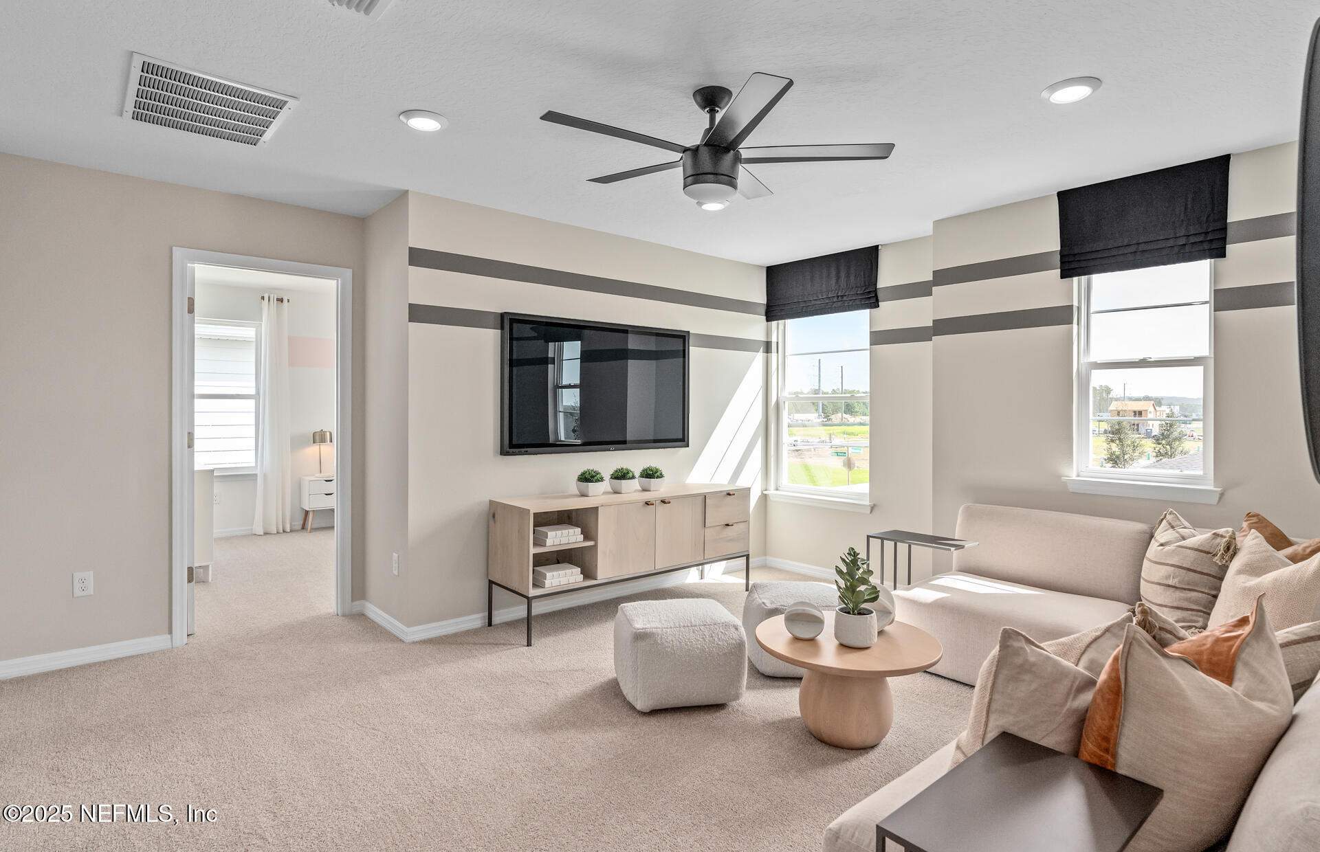 488 Peppervine Way Yulee, FL 32097 - Photo 17 of 17 a living room with furniture and a flat screen tv