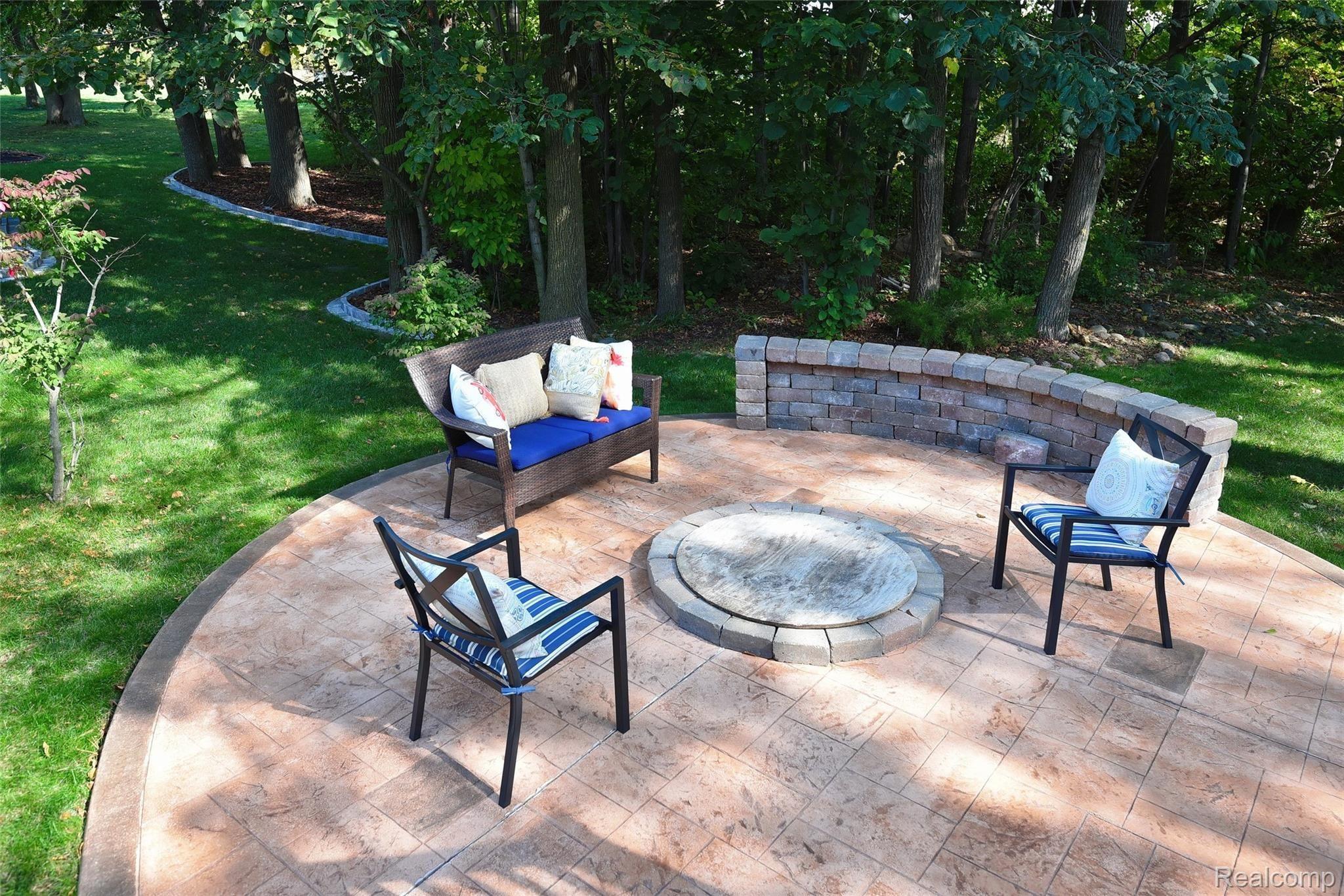 1205 Arms Court Rochester, MI 48307 - Photo 31 of 38 Stamped concrete patio with fire pit