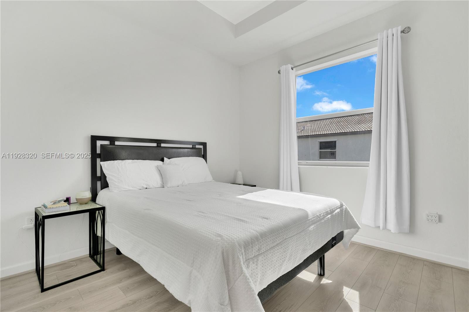 16266 Southwest 291st Street Homestead, FL 33033 - Photo 18 of 34 a bedroom with a bed and a window