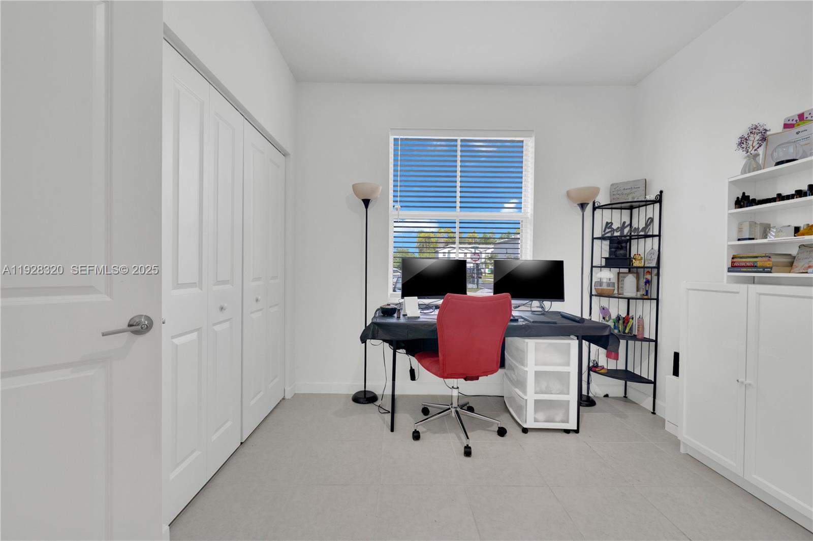 16266 Southwest 291st Street Homestead, FL 33033 - Photo 20 of 34 a work room with furniture a bookshelf and a window