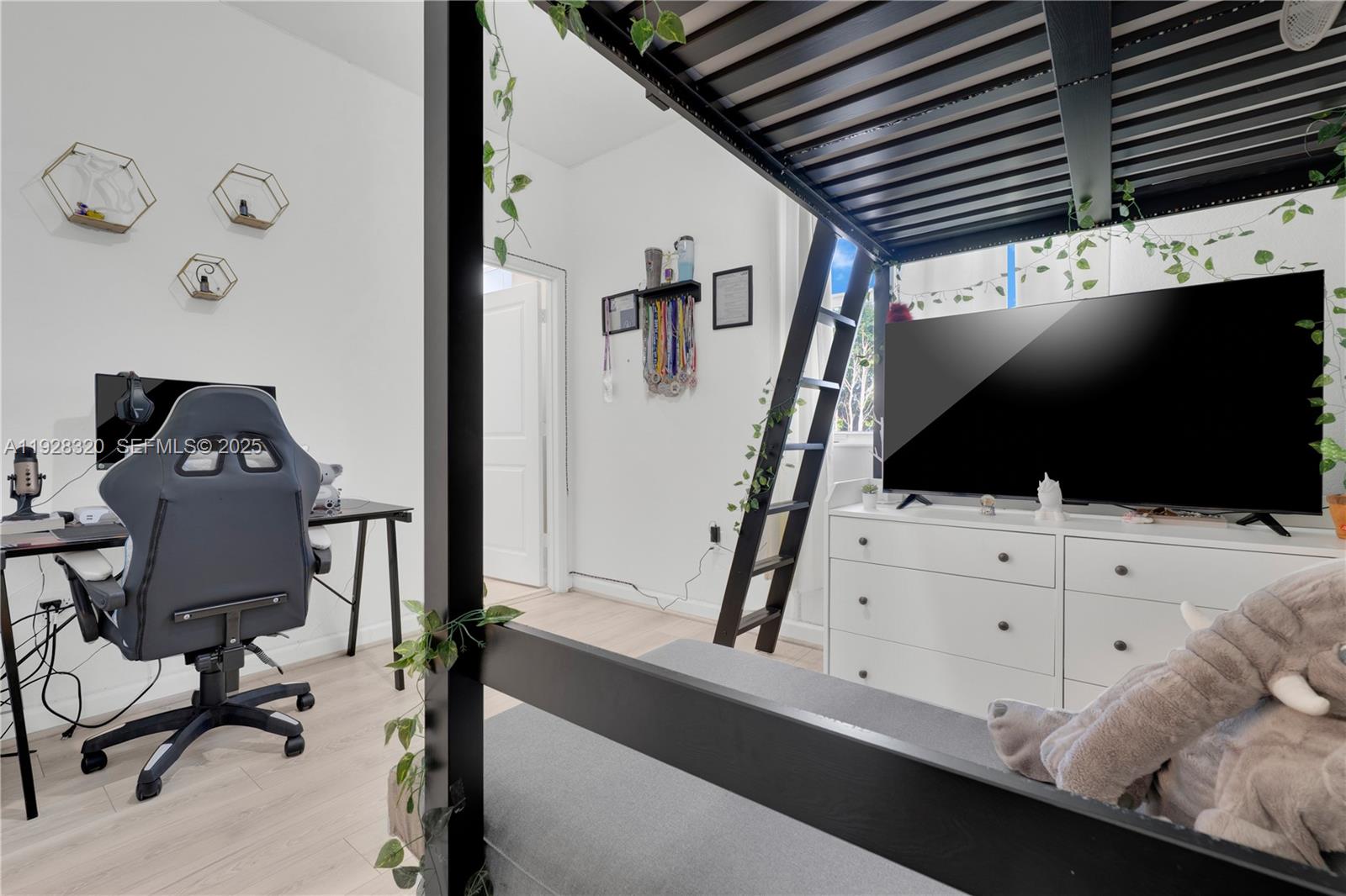 16266 Southwest 291st Street Homestead, FL 33033 - Photo 21 of 34 a living room with furniture and a flat screen tv