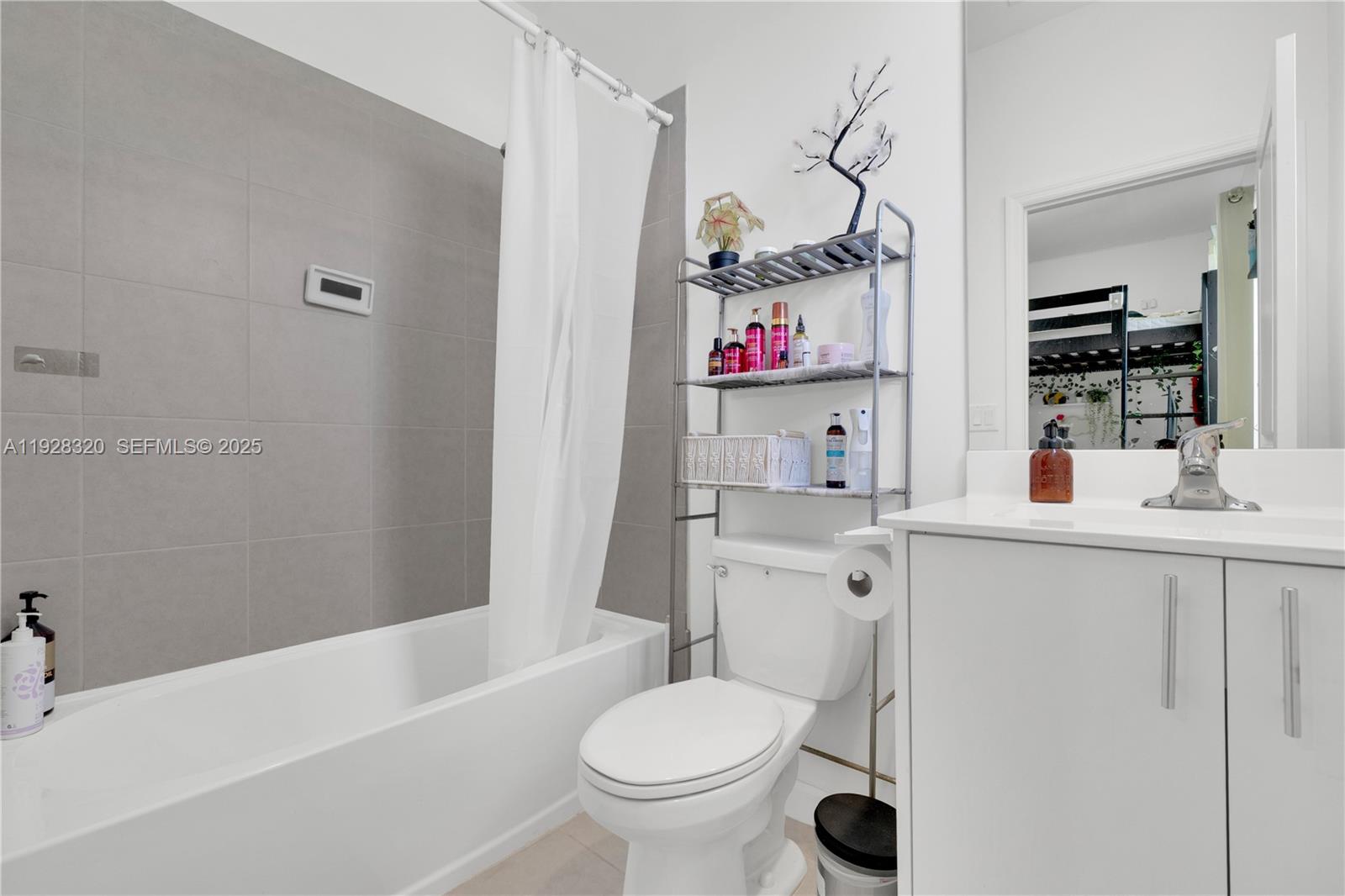 16266 Southwest 291st Street Homestead, FL 33033 - Photo 27 of 34 a bathroom with a sink toilet vanity and tub