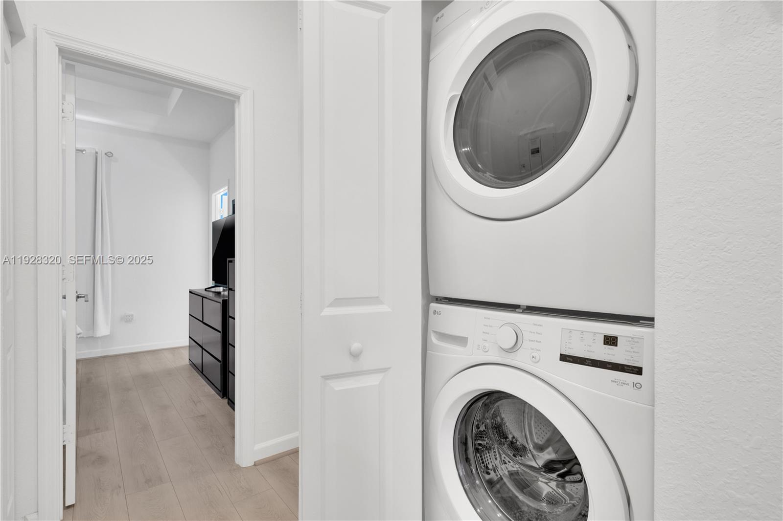 16266 Southwest 291st Street Homestead, FL 33033 - Photo 28 of 34 a view of a hallway with washer and dryer