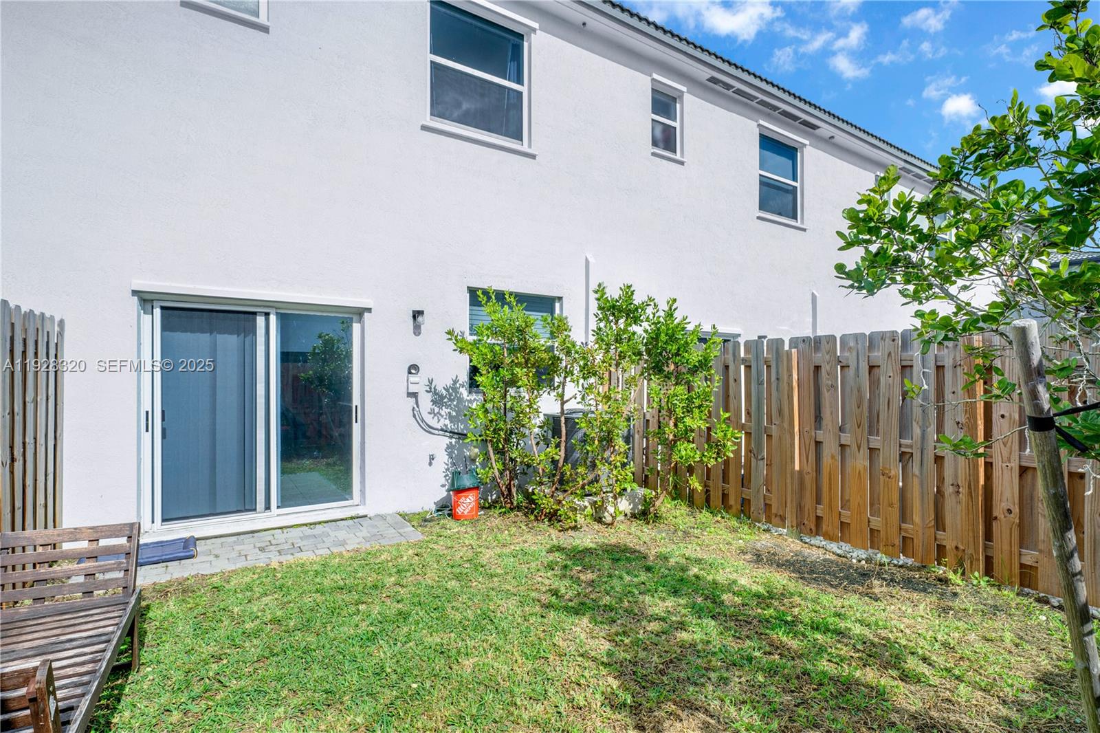 16266 Southwest 291st Street Homestead, FL 33033 - Photo 29 of 34 a front view of a house with garden